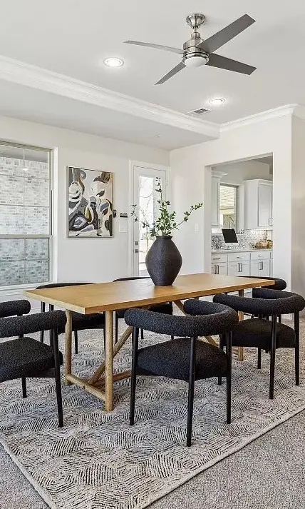 Wooden dining table with black seating